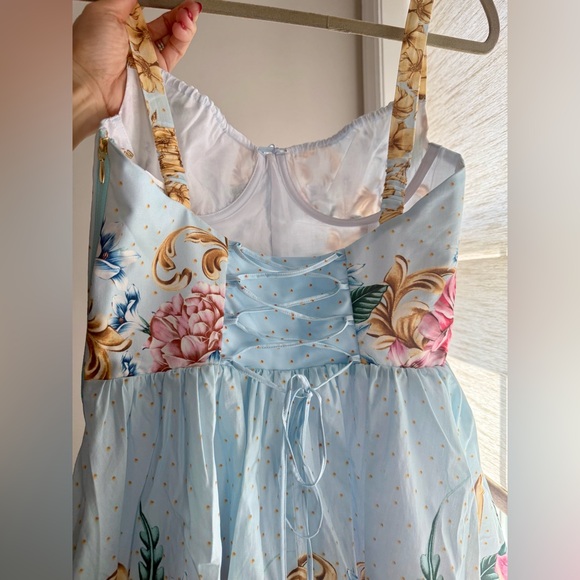 Agua Bendita, Resort Wear
Riveria Radiance Spring Blush Floral Cotton Minidress - Picture 7 of 11